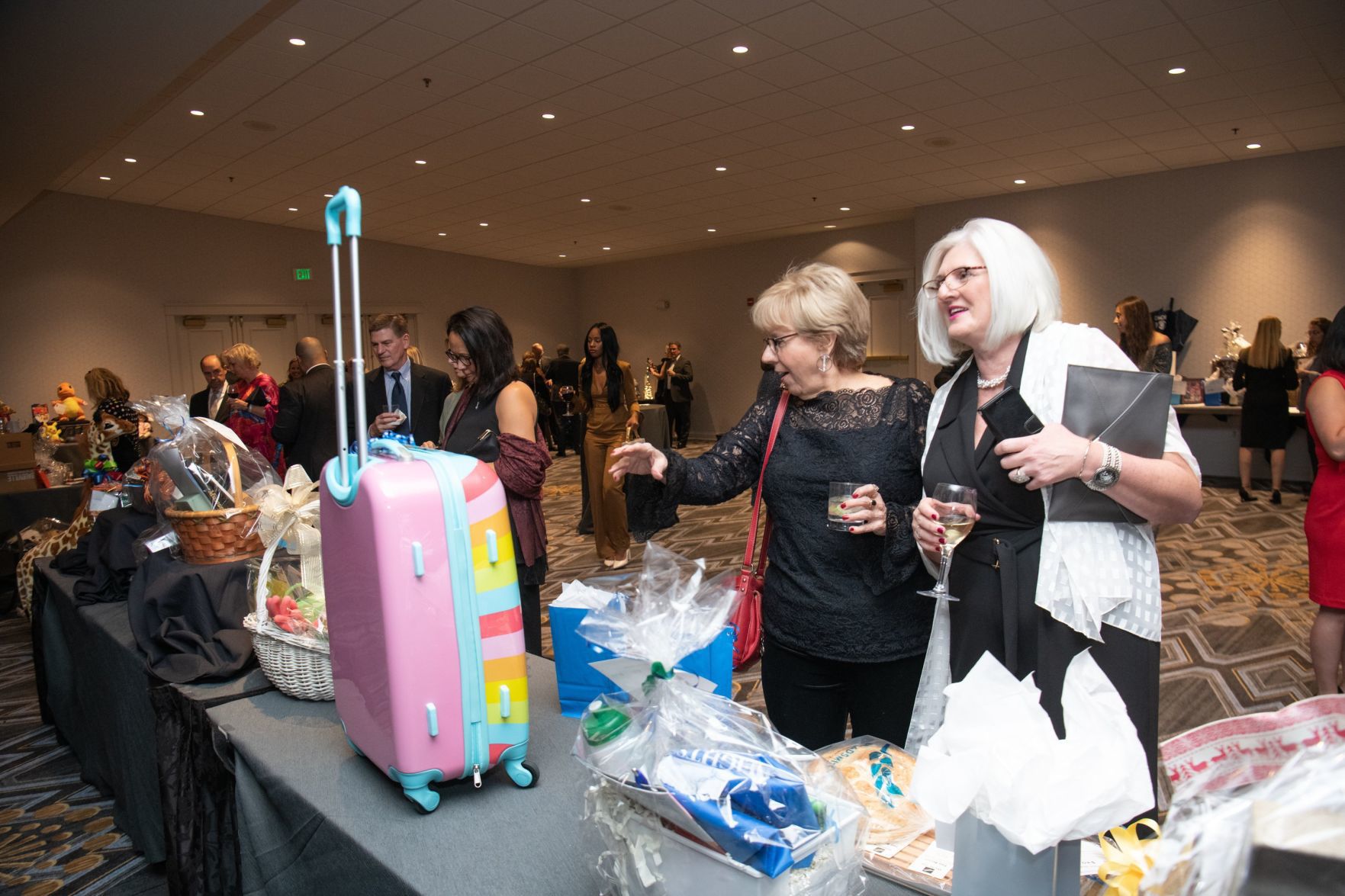 Guests browse the silent auction items during the cocktail reception